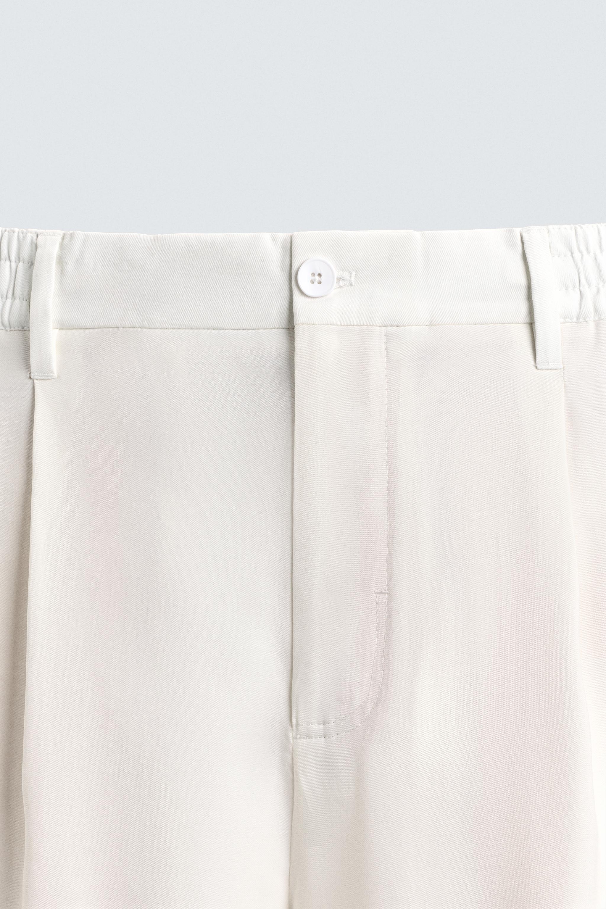 RELAXED FIT PLEATED PANTS